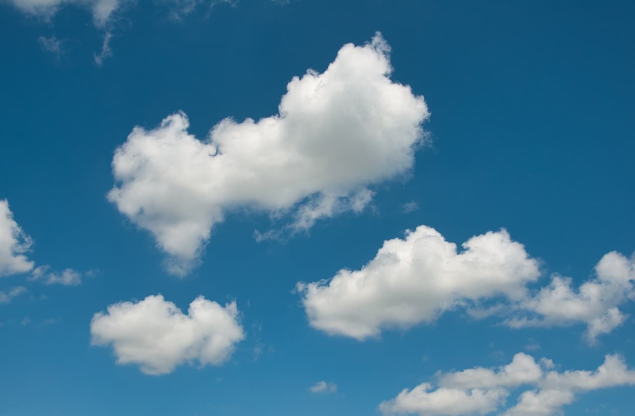 Clear blue sky with white clouds over Canada